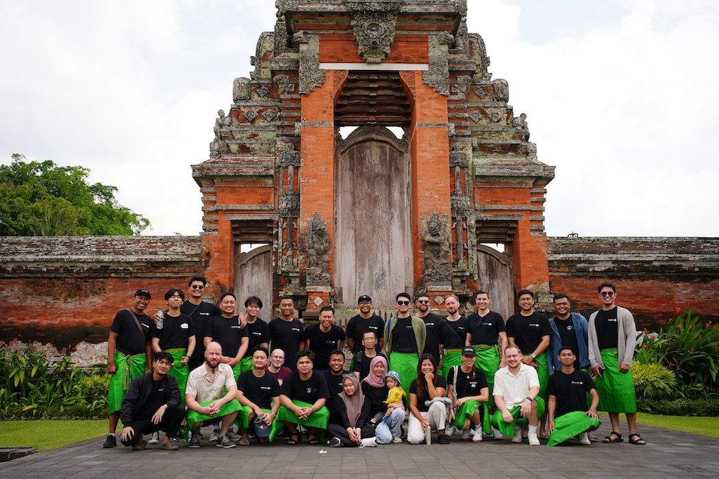 Wolkk team photo at a temple in Southeast Asia